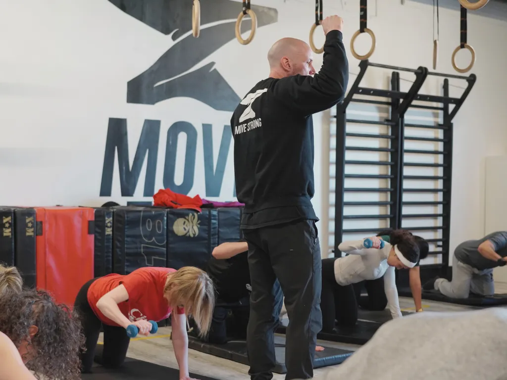 Move Strong coach leading a structured class at the Kitchener-Waterloo studio