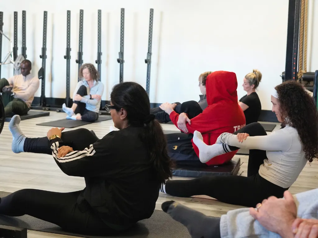 Mobility and joint-health work during a coached class at Move Strong in Kitchener-Waterloo