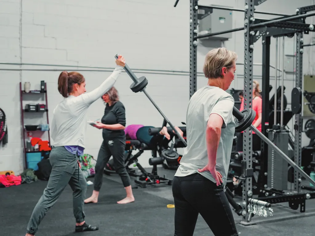 Coach guiding a Define session at Move Strong