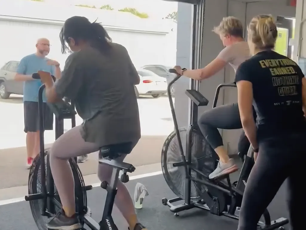 Coach guiding a HYROX conditioning session at Move Strong