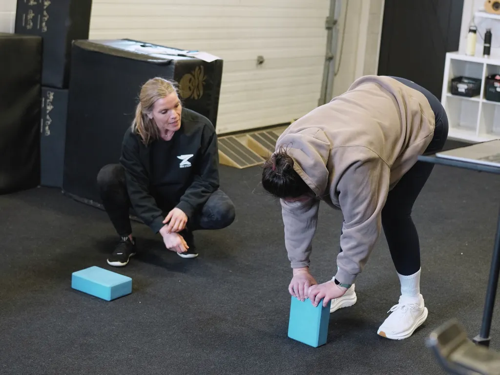 Move Strong coach providing one-on-one training at the Kitchener-Waterloo studio