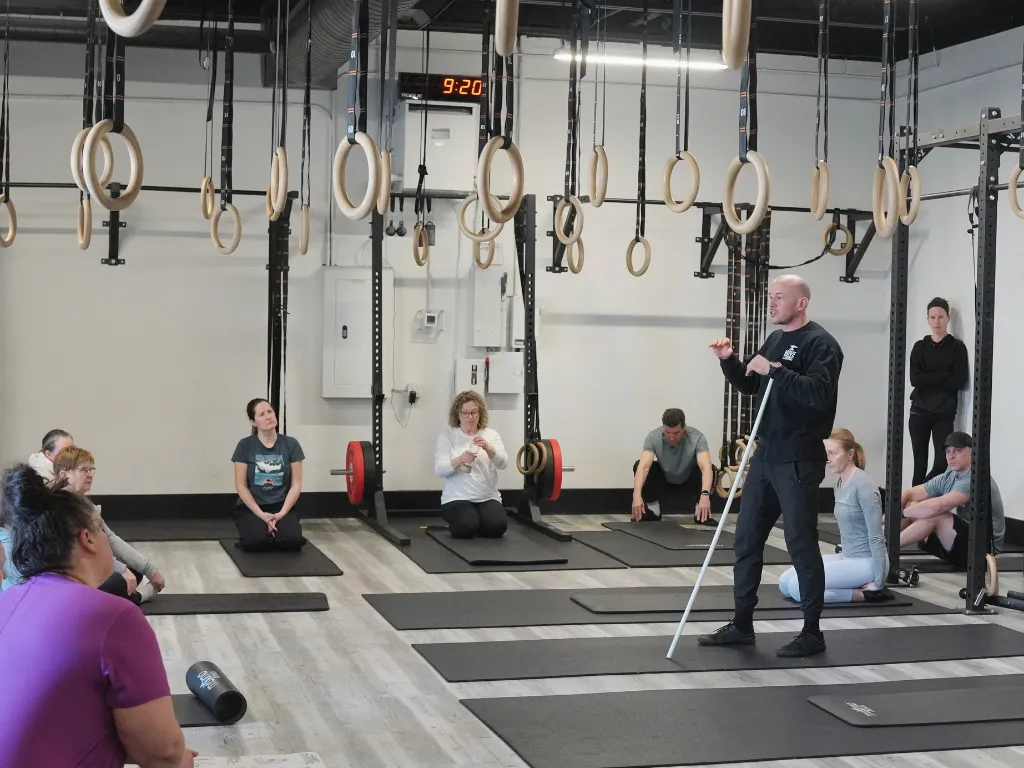 Coach cueing a Foundations class at Move Strong